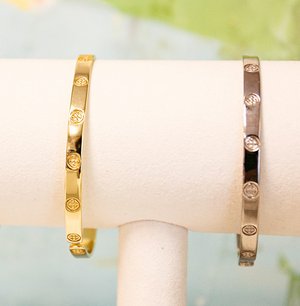 shield embossed bangle bracelet